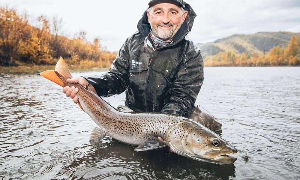 Taimen trout released by angler into Mongolia river during Autumn season