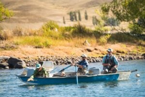 Fly fishing from skiff boat, Argentina