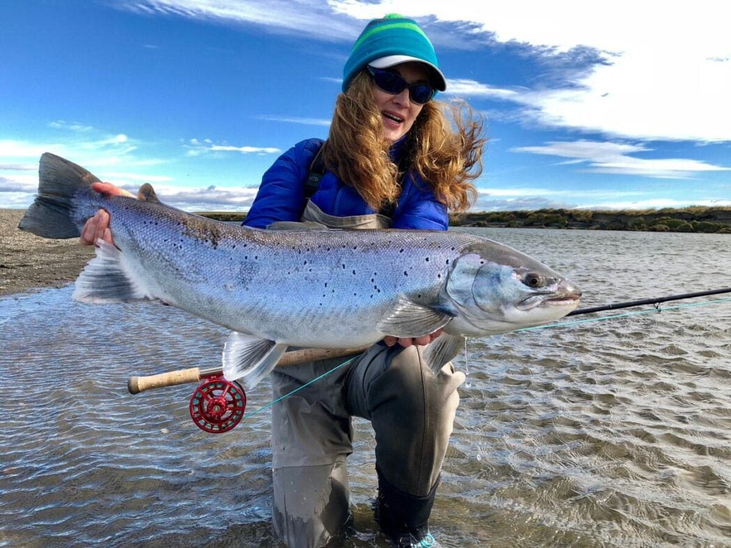 Woman holding sea-run brown trout