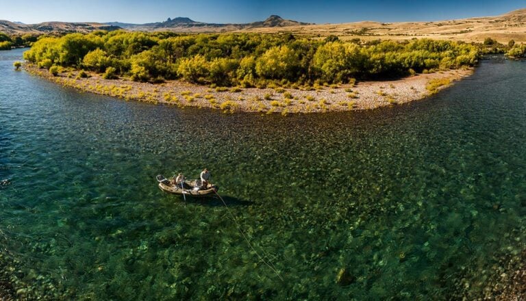 Boat fly fishing crystal clear water, Patagonia