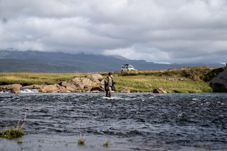 Man salmon fishing river in Iceland