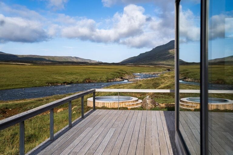 Large wooden decking area beside salmon river