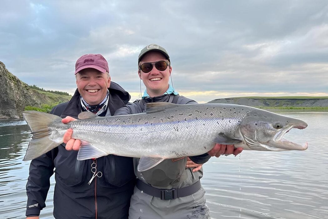 Salmon fishing in Iceland, anglers holding large fish