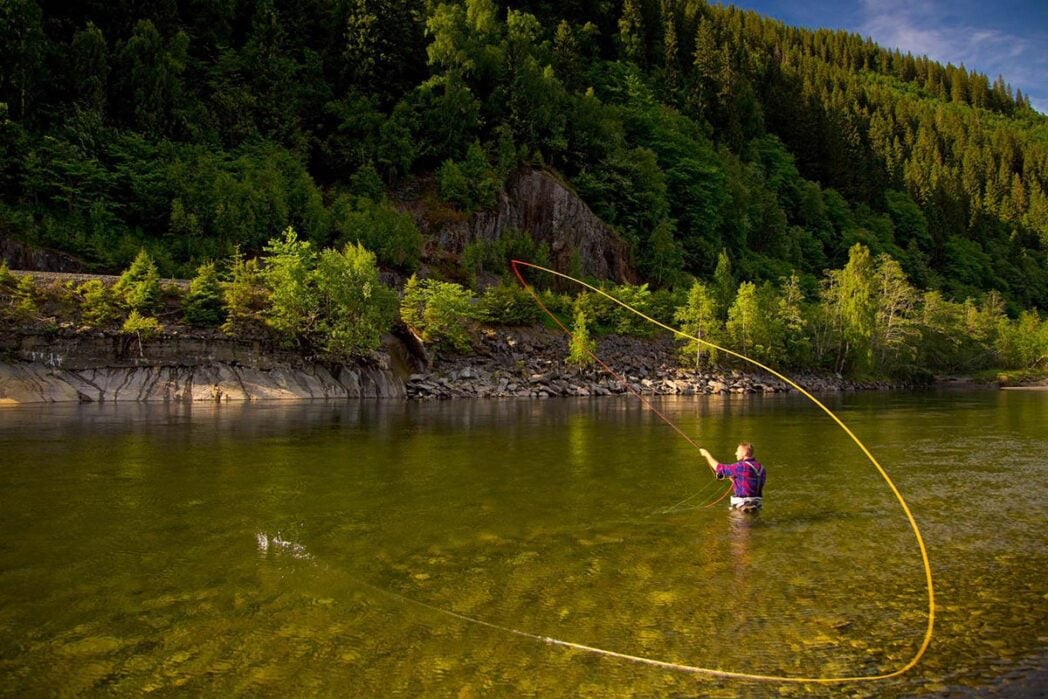 Angler spey casting on Norwegian river