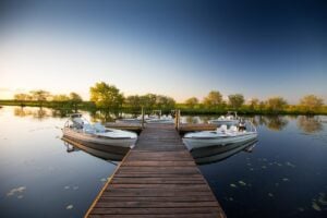 Skiff boats moored lodge jetty