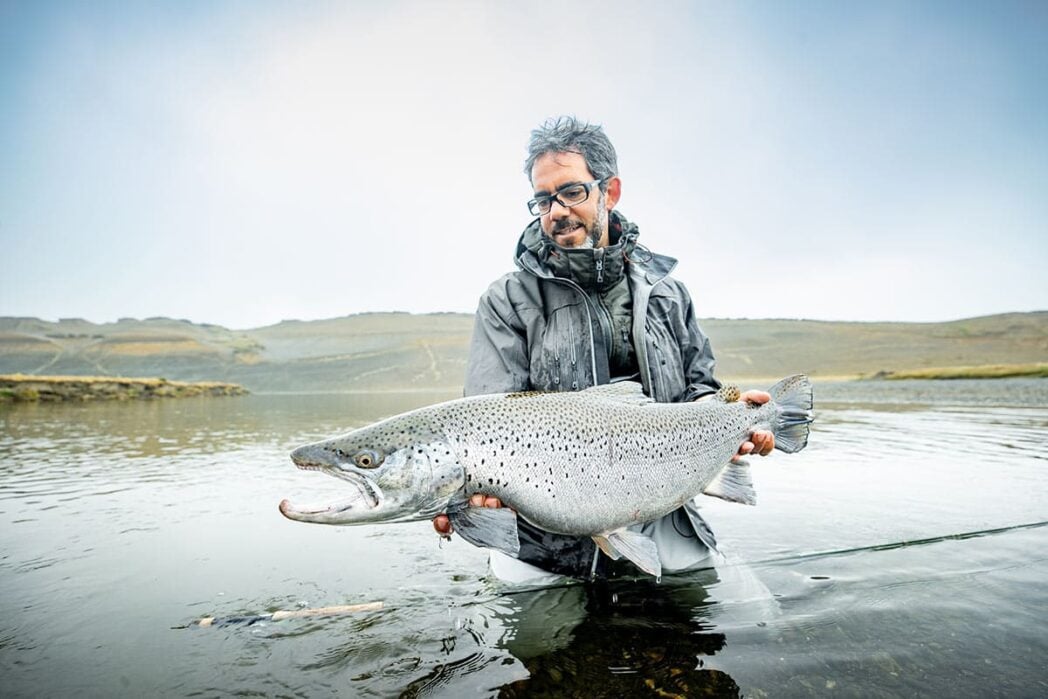 Villa Maria guest holding trophy sea-run brown trout