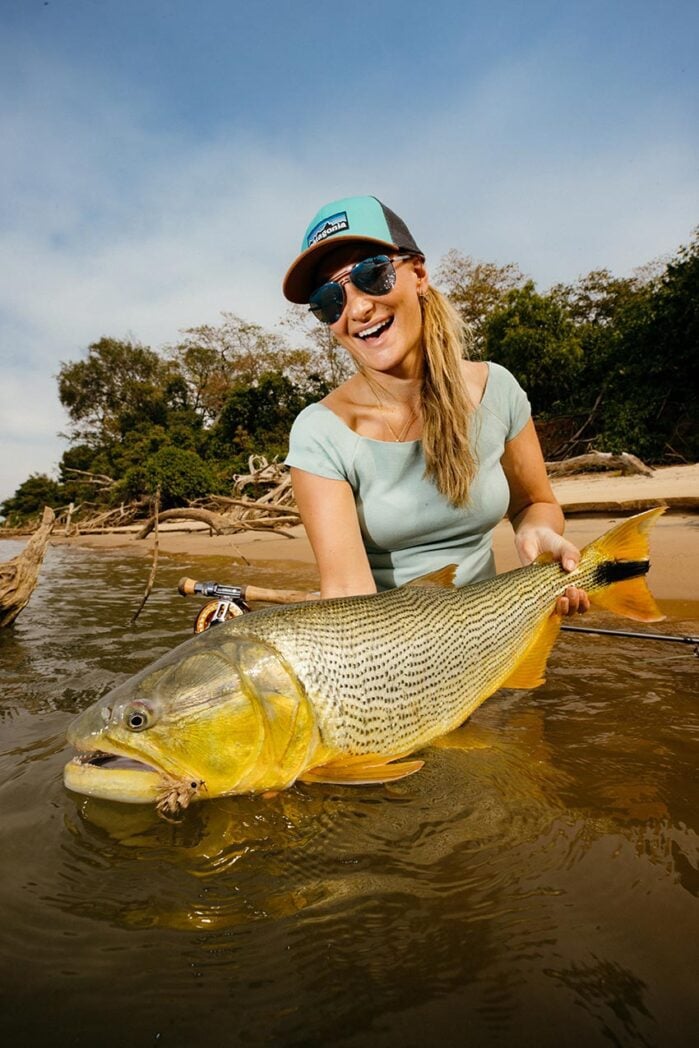 Woman angler holding dorado