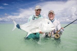 Seychelles fly fishermen holding trevally