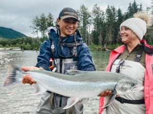 Huge Arctic char trout held by Alaska guide