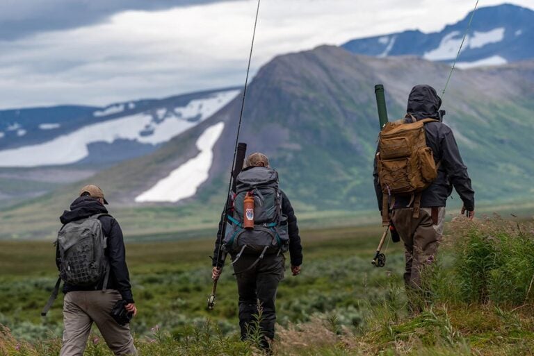 Anglers hiking to fishing, Alaska