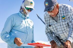 Fishing guides selecting bonefish flies at the Delphi Club in the Bahamas