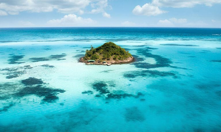 Tiny island in Colombia surrounded by aqua water
