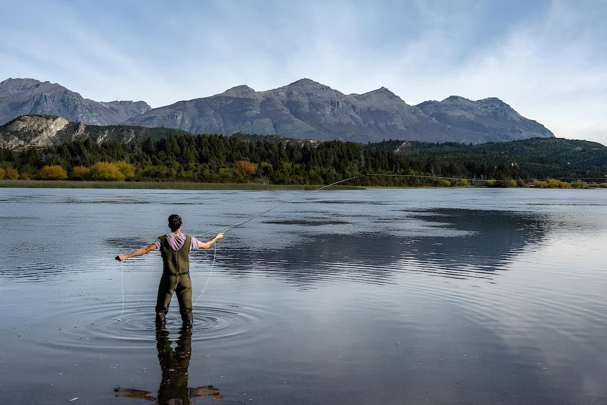 Angler in Chubut Patagoina fly fishing on scenic water