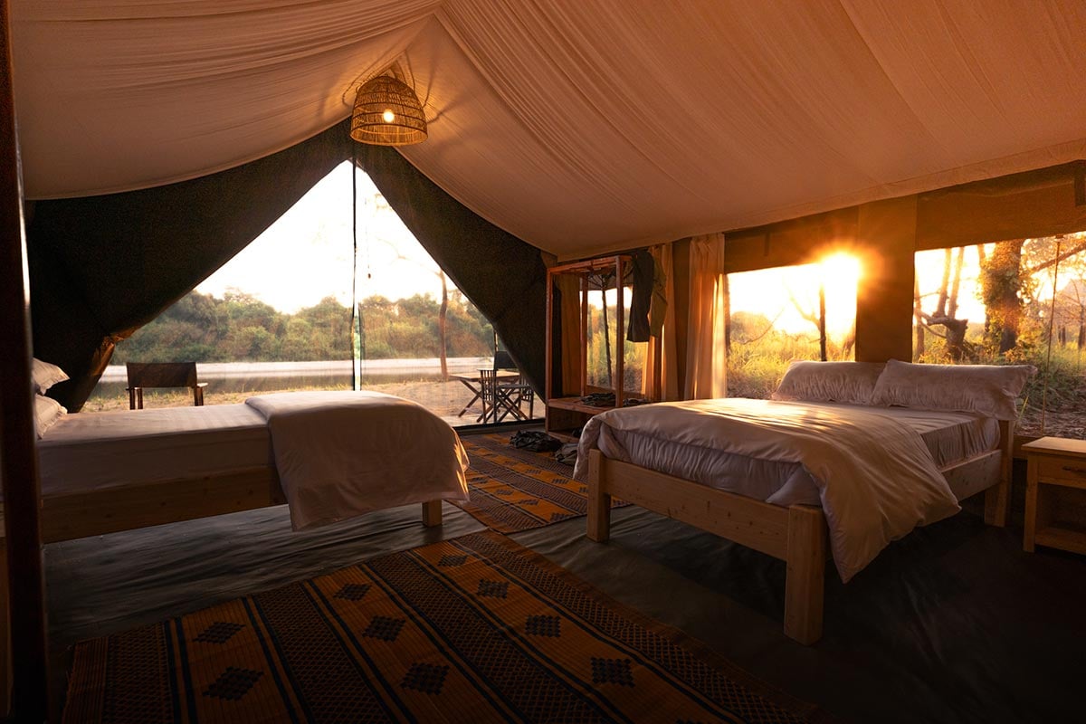 Luxury tented camp in Africa, with beds and bedding