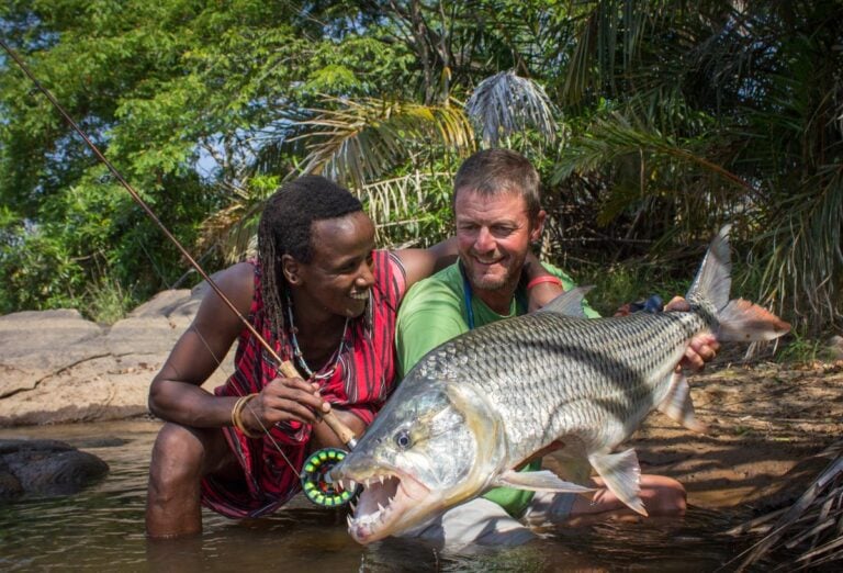 Tigerfish held by angler and local tribesman in Tanzania
