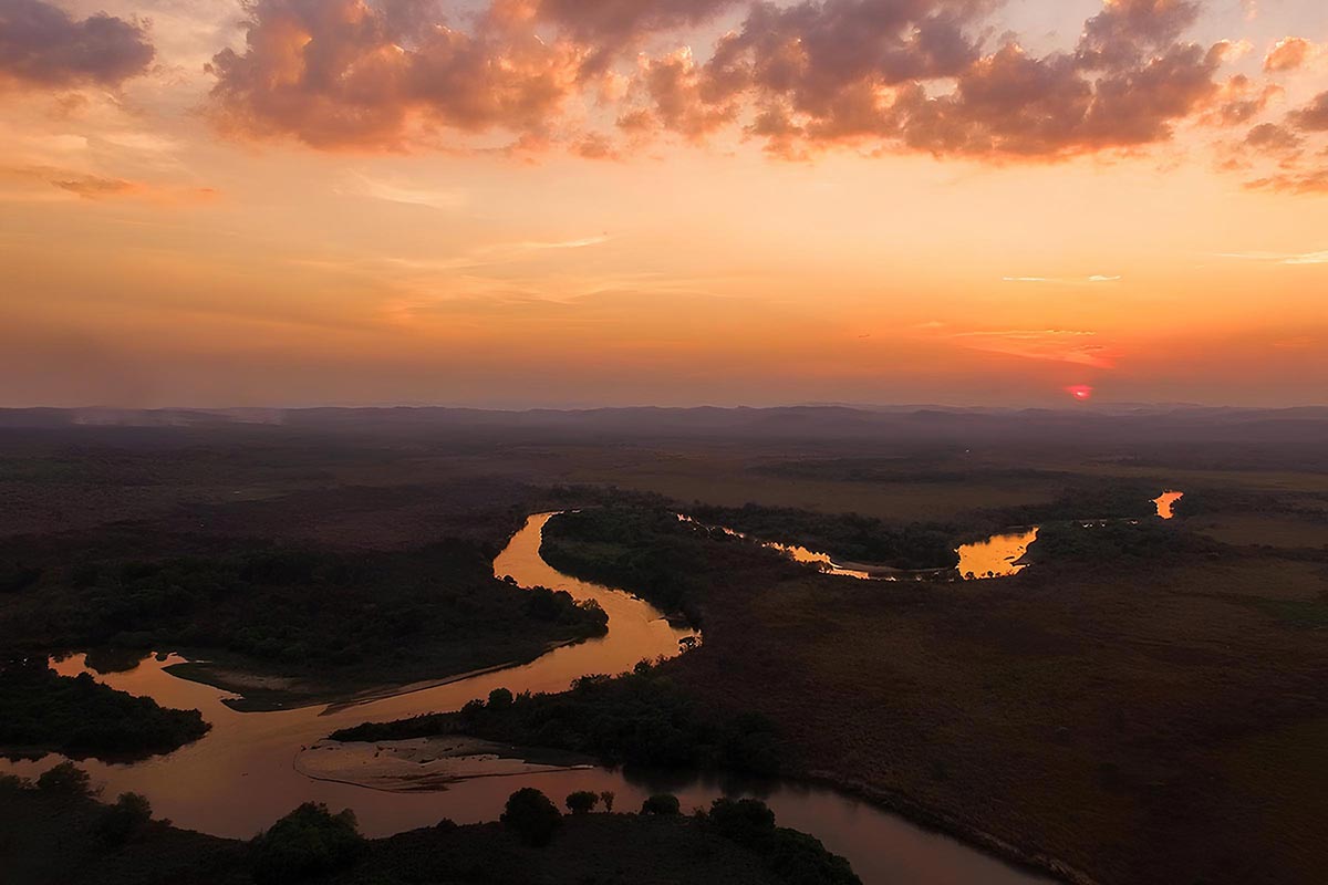 Aerial view of Meandering river in Tanzania in the sunset