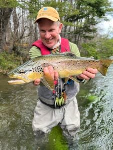 Fly fishing wild brown trout in river, Nahuel Huapi National Park Argentina