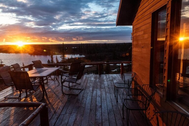 Evening view of Alaska lake and forest from lodge