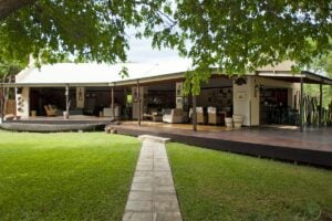 Open-sided main lodge area with lounge and dining at Shackletons Tiger Fishing Lodge, Zambia